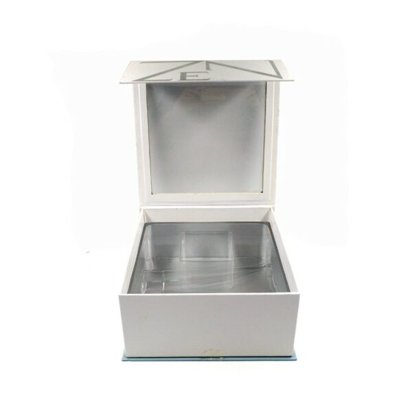 Hinged lid cosmetic box with blister